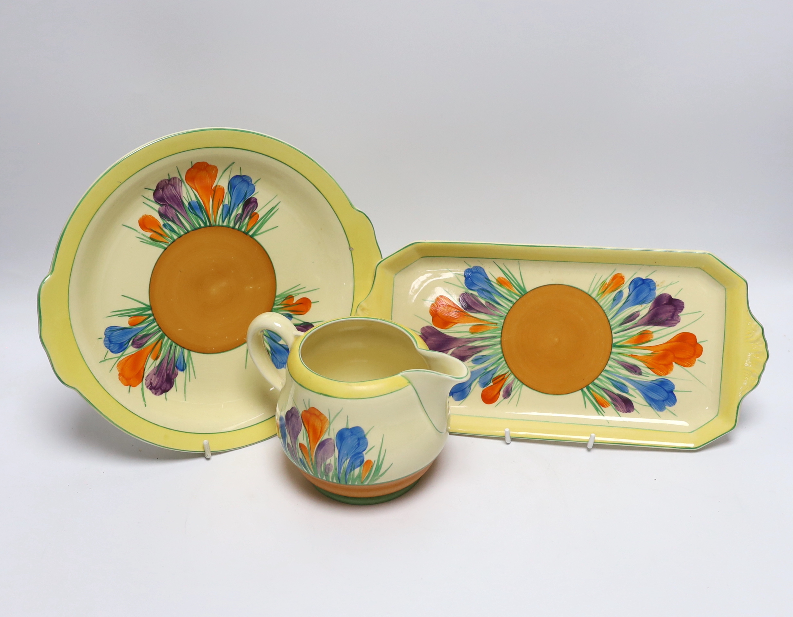 A Clarice Cliff Crocus jug and two dishes, largest 30cm long